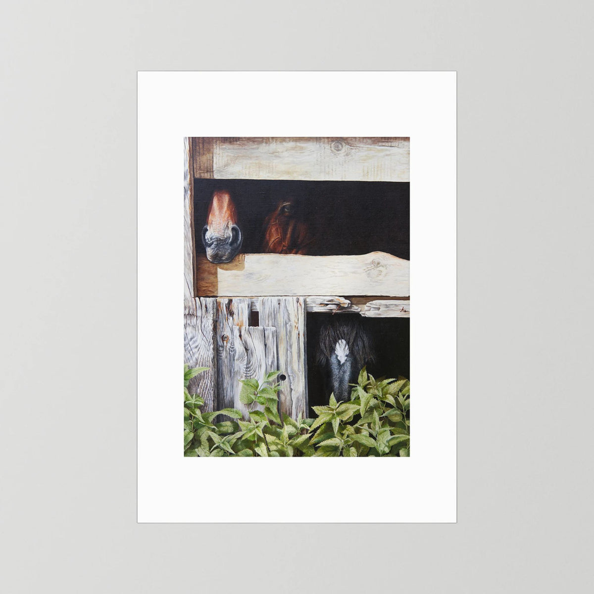 A vertical paper art print featuring a painted scene of horses in wooden stalls with green foliage at the bottom, surrounded by a wide white border (passepartout) and shown against a light gray background.